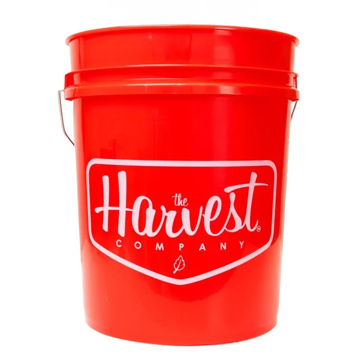 Red bucket with 'The Harvest Company' logo on a white background