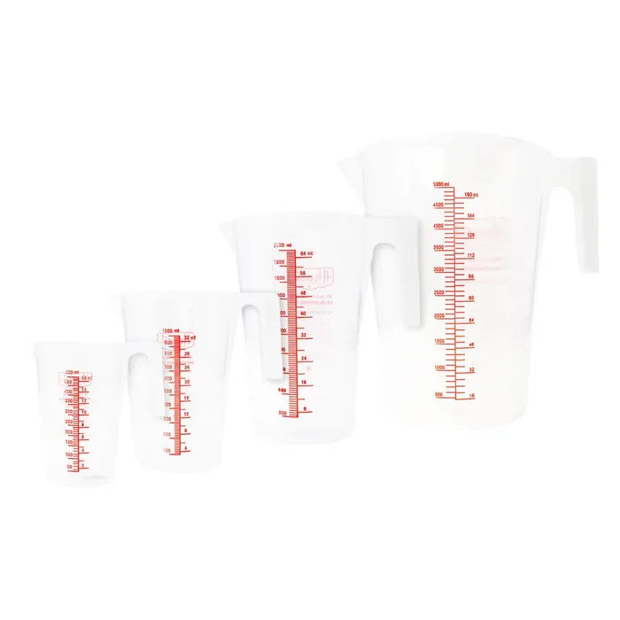 Set of four clear measuring cups with red measurement markings on a white background