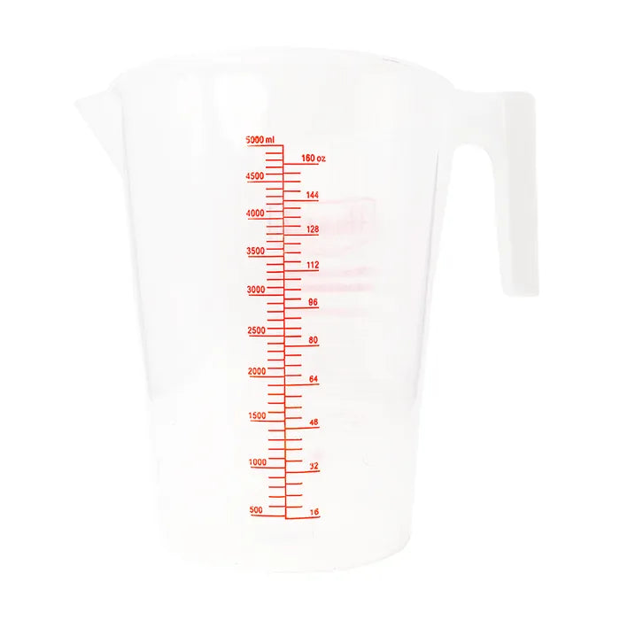 White measuring cup with red measurement markings on a white background