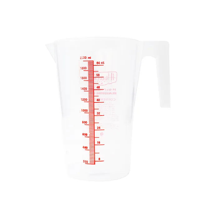Clear measuring cup with red measurement markings on a white background