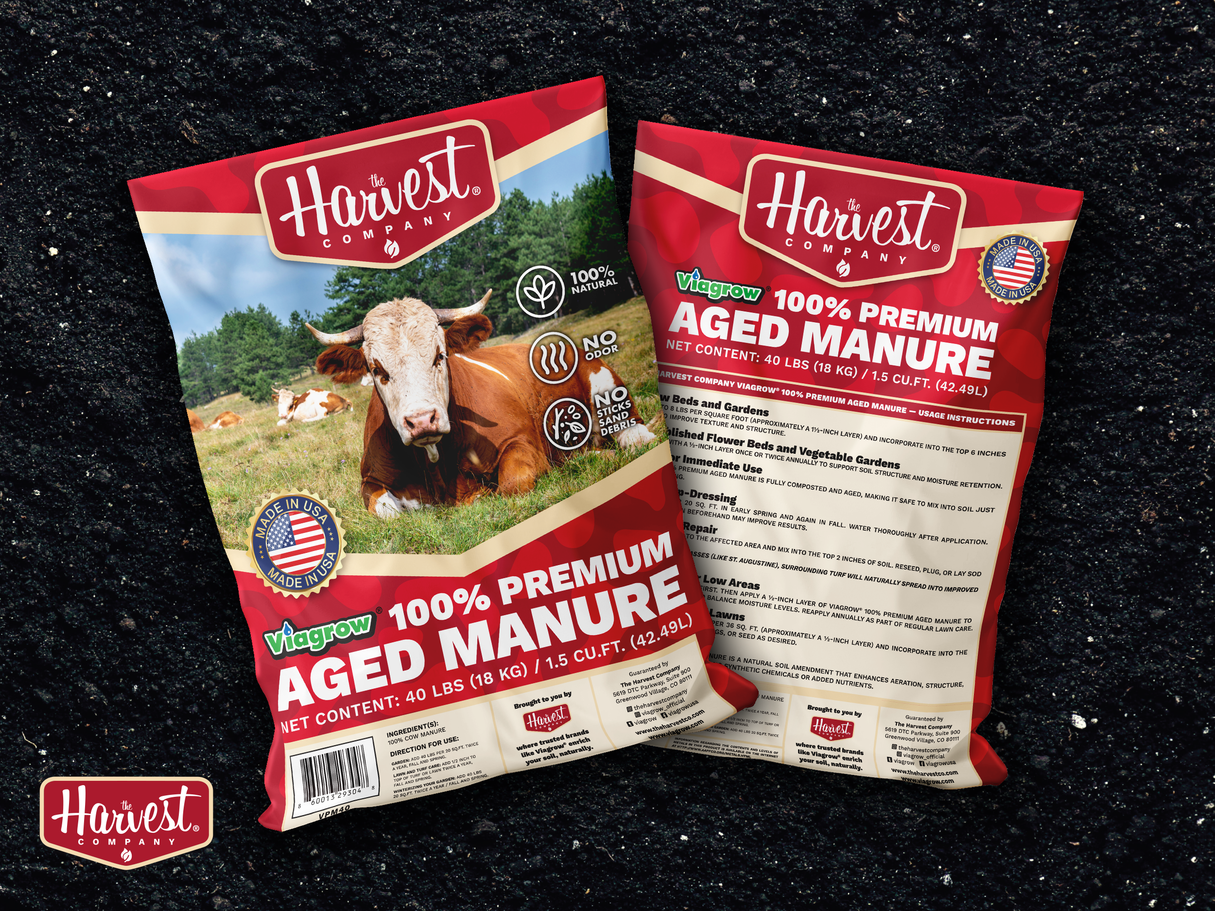 Two packages of Harvest Company aged manure on a dark background