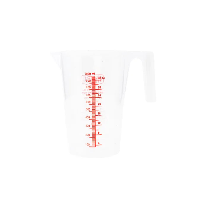 White measuring cup with red measurement markings on a white background