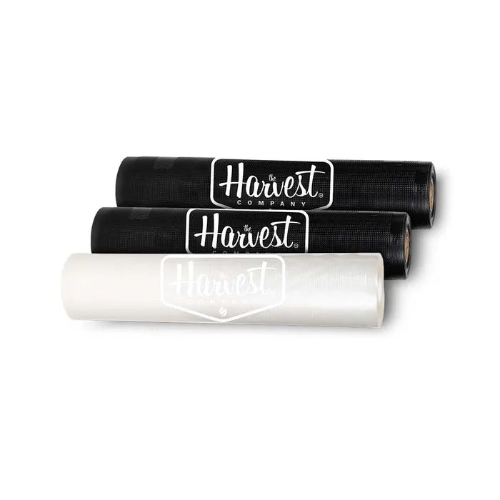Three rolls of black and white plastic sheeting with 'The Harvest Company' logo on a white background.