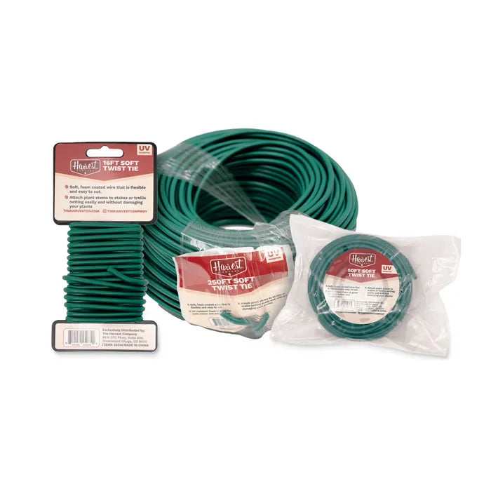 Green garden hose with packaging on a white background