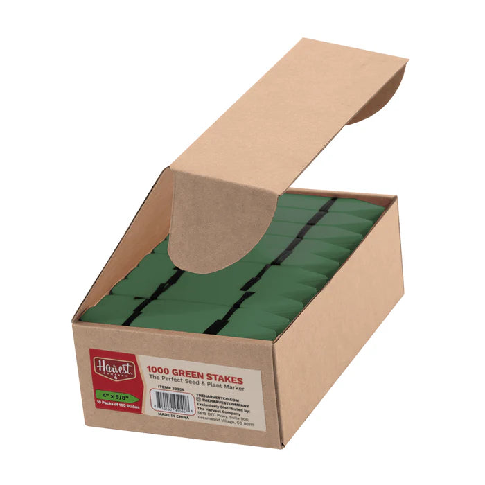 Box of green stakes with a visible brand label on a white background